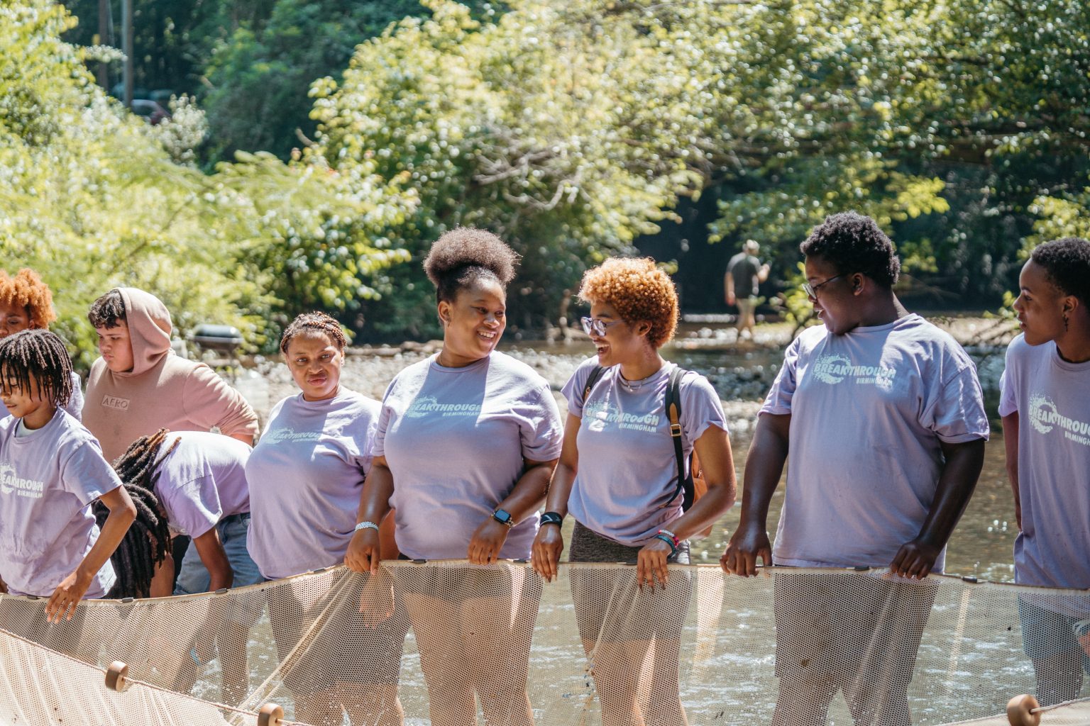 Students and educators exploring the river together